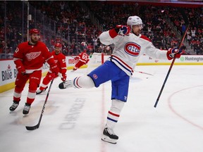 Canadiens' Tomas Tatar opened the scoring for Montreal Canadiens celebrates his first period goal next to Filip Hronek #17 of the Detroit Red Wings at Little Caesars Arena on February 26, 2019 in Detroit, Michigan.