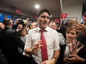 Prime Minister Justin Trudeau campaigns with Richard T. Lee,(behind Trudeau) the Liberal candidate in the upcoming Burnaby South byelection on Feb. 10, 2019. (The Canadian Press)