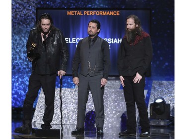 Matt Pike, from left, Des Kensel and Jeff Matz, of Electric Messiah, accept the award for best metal performance for "High On Fire" at the 61st annual Grammy Awards on Sunday, Feb. 10, 2019, in Los Angeles.
