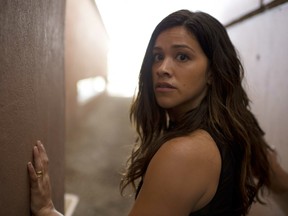 This image released by Sony Pictures shows Gina Rodríguez in a scene from "Miss Bala." (Gregory Smith/Sony Pictures via AP)