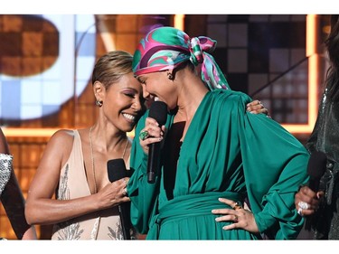 Host US singer-songwriter Alicia Keys (R) and Jada Pinkett Smith speak on stage during the 61st Annual Grammy Awards on February 10, 2019, in Los Angeles.