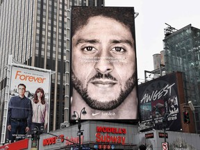 In this file photo taken on Sept. 8, 2018, a Nike ad featuring American football quarterback Colin Kaepernick is diplayed in New York City. (ANGELA WEISS/AFP/Getty Images)