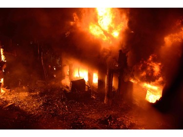 Flames and smoke rise from building after a fire broke out in an old part of the Bangladeshi capital Dhaka on Feb. 21, 2019.