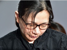 This file photo taken on May 22, 2015 shows former Korean Air (KAL) executive Cho Hyun-Ah surrounded by journalists after receiving a suspended jail sentence at a court in Seoul. - The husband of a Korean Air heiress known for a "nut rage" tantrum that sparked uproar in South Korea has accused his wife of abusing him and their young children, police said on February 21, 2019.