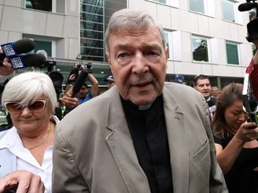 Cardinal George Pell leaves the County Court of Victoria court after prosecutors decided not to proceed with a second trial on alleged historical child sexual offences in Melbourne on February 26, 2019.