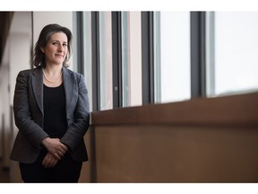 Christine Langlois, a communications worker for Canadian Air Transport Security Authority, stands near a window in the Regina International Airport.