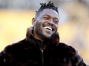 Pittsburgh Steelers wide receiver Antonio Brown stands along the sideline in street clothes before a game against the Cincinnati Bengals, Sunday, Dec. 30, 2018, in Pittsburgh. (AP Photo/Don Wright)