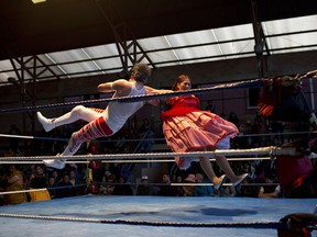 Veteran cholita wrestler Jennifer Dos Caras, 45, competes in the ring with Randy Four in El Alto, Bolivia, Jan. 21, 2019.