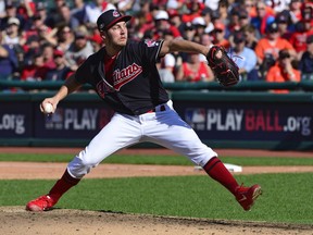 This Oct. 8, 2018, file photo shows Cleveland Indians starting pitcher Trevor Bauer delivering in the sixth inning during Game 3 of a baseball American League Division Series against the Houston Astros, in Cleveland.