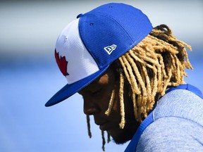 Toronto Blue Jays infielder Vladimir Guerrero Jr. looks down as he arrives during baseball spring training in Dunedin, Fla., on Saturday, February 16, 2019.