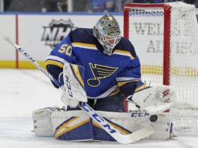 St. Louis Blues goaltender Jordan Binnington (50) makes a save against the New Jersey Devils, Tuesday, Feb. 12, 2019, in St. Louis. (AP Photo/Tom Gannam)