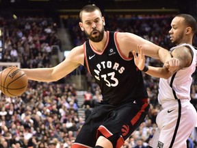 Toronto Raptors Marc Gasol controls the ball as Brooklyn Nets guard Shabazz Napier defends during second half NBA basketball action in Toronto on Monday, Feb. 11, 2019.