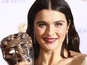 Actress Rachel Weisz poses for photographers backstage with her Best Supporting Actress award for her role in the film 'The Favourite' at the BAFTA awards in London, Sunday, Feb. 10, 2019.