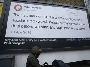 A billboard is displayed as part of the "Led By Donkeys" remain in the European Union supporting campaign, which aims to highlight quotes on Brexit made by politicians and organizations, in Finsbury Park, north London, Friday, Feb. 8, 2019.