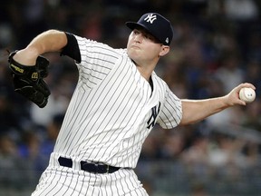 In this July 26, 2018, file photo, New York Yankees' Zach Britton delivers a pitch against the Kansas City Royals, in New York. (AP Photo/Frank Franklin II, File)