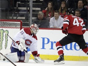New Jersey Devils right wing Nathan Bastian (42) scores his first career goal against Montreal Canadiens goaltender Carey Price (31) during the first period of an NHL hockey game, Monday, Feb. 25, 2019, in Newark, N.J.