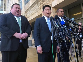 U.S. Attorney Robert Hur, centre, of the District of Maryland, speaks as Art Walker, left, special agent from the Coast Guard investigative service, and Gordon Johnson, special agent in charge of the FBI's Baltimore office, listen during a news conference about Coast Guard Lt. Christopher Paul Hasson, Thursday, Feb. 21, 2019, outside the federal courthouse in Greenbelt, Md. (AP Photo/Michael Kunzelman)
