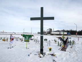 A memorial for the 2018 crash where 16 people died and 13 injured when a truck collided with the Humboldt Broncos hockey team bus, is shown at the crash site on Wednesday, January 30, 2019 in Tisdale, Sask. Saskatchewan's coroner's service has released its report into the Humboldt Broncos bus crash and it calls for tougher enforcement of trucking rules and mandatory seatbelts on highway buses.