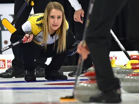 Kadriana Sahaidak watches her teammate Colton Lott sweep his rock in an April 1, 2018, file photo.