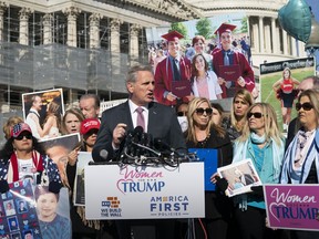 House Minority Leader Kevin McCarthy, R-Calif., joins supporters of President Donald Trump and family members of Americans killed by undocumented immigrants as they gather to to promote their support for a border wall with Mexico, at the Capitol in Washington, Wednesday, Feb. 13, 2019.