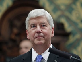 In this Jan. 23, 2018, former Michigan Gov. Rick Snyder delivers his State of the State address at the state Capitol in Lansing, Mich.