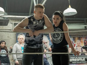This image released by Metro Goldwyn Mayer Pictures shows Jack Lowden, left, and Florence Pugh in a scene from "Fighting with My Family."