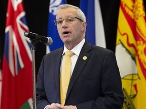Ontario Finance Minister Vic Fedeli speaks with media following meetings with federal, provincial and territorial counterparts in Ottawa, Monday Dec. 10, 2018.