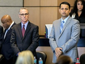Defence attorney Scott Richardson and Nouman Raja, right, watch as prospective jurors for his trial enter the courtroom Monday, Feb. 25, 2019 in West Palm Beach, Fla.