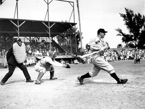 In this March 22, 1937, file photo Lou Gehrig bats the ball for the New York Yankees in his first exhibition game of the season against the Boston Bees in St. Petersburg, Fla.