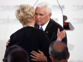 United States Vice President Mike Pence hugs Cindy McCain, widow of US Senator John McCain, after delivering his speech during the John McCain Dissertation Award Ceremony at the Bavarian State Parliament in Munich, Germany, Friday, Feb. 15, 2019. Pence arrived Thursday to attend the Munich Security Conference.
