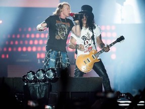 Axl Rose, left, lead singer of the rock band Guns N' Roses, performs with Slash at Parken Stadium, Copenhagen, June 27, 2017. (MADS JOAKIM RIMER RASMUSSEN/AFP/Getty Images)