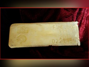 This undated file photo provided by the FBI shows a gold bar that was recovered in Miami from a heist in North Carolina on March 1, 2015.