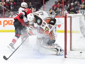 Anaheim Ducks goaltender John Gibson gets hit by teammate Jaycob Megna (43) as the Ottawa Senators' Matt Duchene (95) scores during the second period at the CTC on Thursday, Feb 7, 2019.