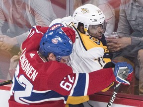 Nashville Predators defence man P.K. Subban gets checked into the glass by Canadiens forward Artturi Lehkonen during NHL game at the Bell Centre in Montreal on Jan. 5, 2019.