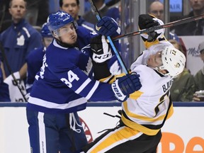 Auston Matthews runs into Pittsburgh Penguins centre Nick Bjugstad during second-period NHL hockey action in Toronto on Saturday, Feb. 2, 2019. THE CANADIAN PRESS/Nathan Denette