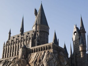 Guests experience the magnificence of Hogwarts castle as it towers above Hogsmeade at The Wizarding World of Harry Potter, at Universal Orlando Resort. (Supplied)