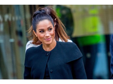 The Duchess of Sussex wears a Givenchy coat to her engagement with the Association of Commonwealth Universities (ACU) in London, Jan. 31, 2019.