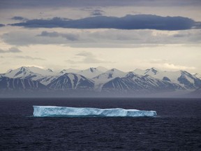 An iceberg floats past Bylot Island in the Canadian Arctic Archipelago, Monday, July 24, 2017.