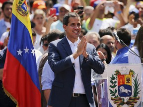 Venezuelan opposition leader Juan Guaido, who has declared himself the interim president of Venezuela, greets supporters as he arrives at a demonstration in Caracas, Saturday, Feb. 2, 2019. (THE CANADIAN PRESS/AP/Fernando Llano)