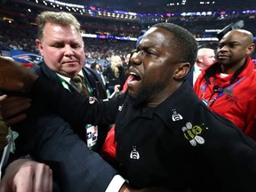 Actor and comedian Kevin Hart celebrates the New England Patriots 13-3 win over the Los Angeles Rams during Super Bowl LIII at Mercedes-Benz Stadium in Atlanta on Sunday, Feb. 3, 2019.