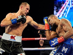 Sergey Kovalev, left, hits Eleider Alvarez during a WBO light heavyweight title boxing match, early Sunday, Feb. 3, 2019, in Frisco, Texas.