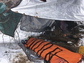 In this Sunday, Feb. 17, 2019 photo provided by the National Park Service. a rescued hiker is treated after being stuck in quicksand after getting stranded in a creek, in Zion National Park, Utah. (National Park Service via AP)