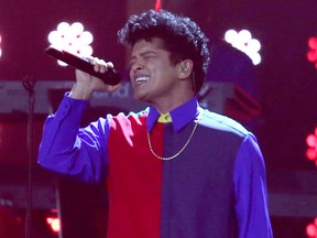 In this Feb. 22, 2017 file photo, singer Bruno Mars performs on stage at the Brit Awards 2017 in London.