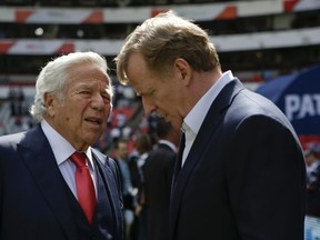 In this Nov. 19, 2017, file photo, NFL Commissioner Roger Goodell, right, talks with New England Patriots owner Robert Kraft before the Patriots face the Oakland Raiders in Mexico City.