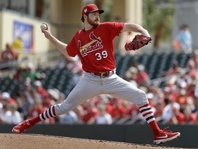 St. Louis Cardinals starting pitcher Miles Mikolas throws during a spring training game against the Miami Marlins Saturday, Feb. 23, 2019, in Jupiter, Fla. (AP Photo/Jeff Roberson)