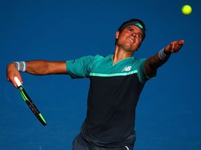 Milos Raonic serves in his quarter final match against Lucas Pouille during the Australian Open at Melbourne Park on Jan. 23, 2019 in Melbourne, Australia.