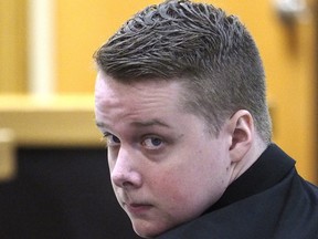 Defendant Liam McAtasney looks toward the gallery where his family is seated, Tuesday, Feb. 5, 2019, during his murder trial at the Monmouth County courthouse in Freehold, N.J. McAtasney is accused of killing Sarah Stern in December 2016.
