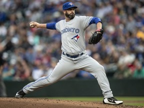 Blue Jays relief pitcher Mike Hauschild delivers a pitch during the second inning of a game against the Mariners at Safeco Field in Seattle on Aug. 2, 2018.