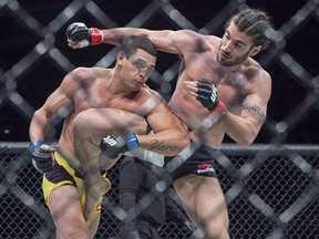 Elias Theodorou, right, of Mississauga, Ont., battles Cezar Ferreira, of Brazil, in middleweight UFC Fight Night action, in Halifax on Sunday, Feb. 19, 2017. The main event has yet to be announced but the UFC has already lined up seven Canadians including 14th-ranked middleweight contender Elias (The Spartan) Theodorou for the televised Fight Night card.