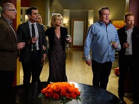 This image released by ABC shows, from left, Ed O'Neill, Ty Burrell, Sofia Vergara, obscured, Julie Bowen, Eric Stonestreet and Jesse Tyler Ferguson in a scene from "Modern Family."